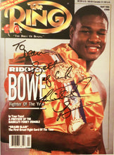 Riddick Bowe Autographed with inscriptions 8 x 10 Photo