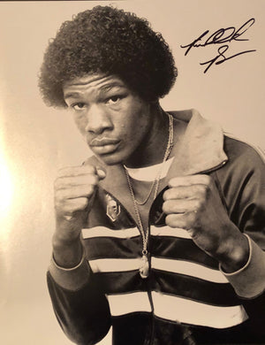 Riddick Bowe 11 x 14 autographed photo of a young Heavyweight Champion Bowe