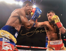 Vasyl Lomachenko action packed Autographed 8x10 fighting photo with a Gold Signature, JSA